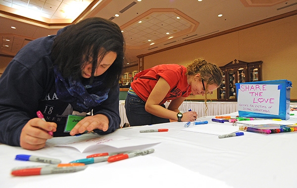 WACY Wyoming County students Johanna Malik and Mary Zielinski write letters to students in Florida who survived the recent school shooting. (Dan Cappellazzo/Staff Photographer)